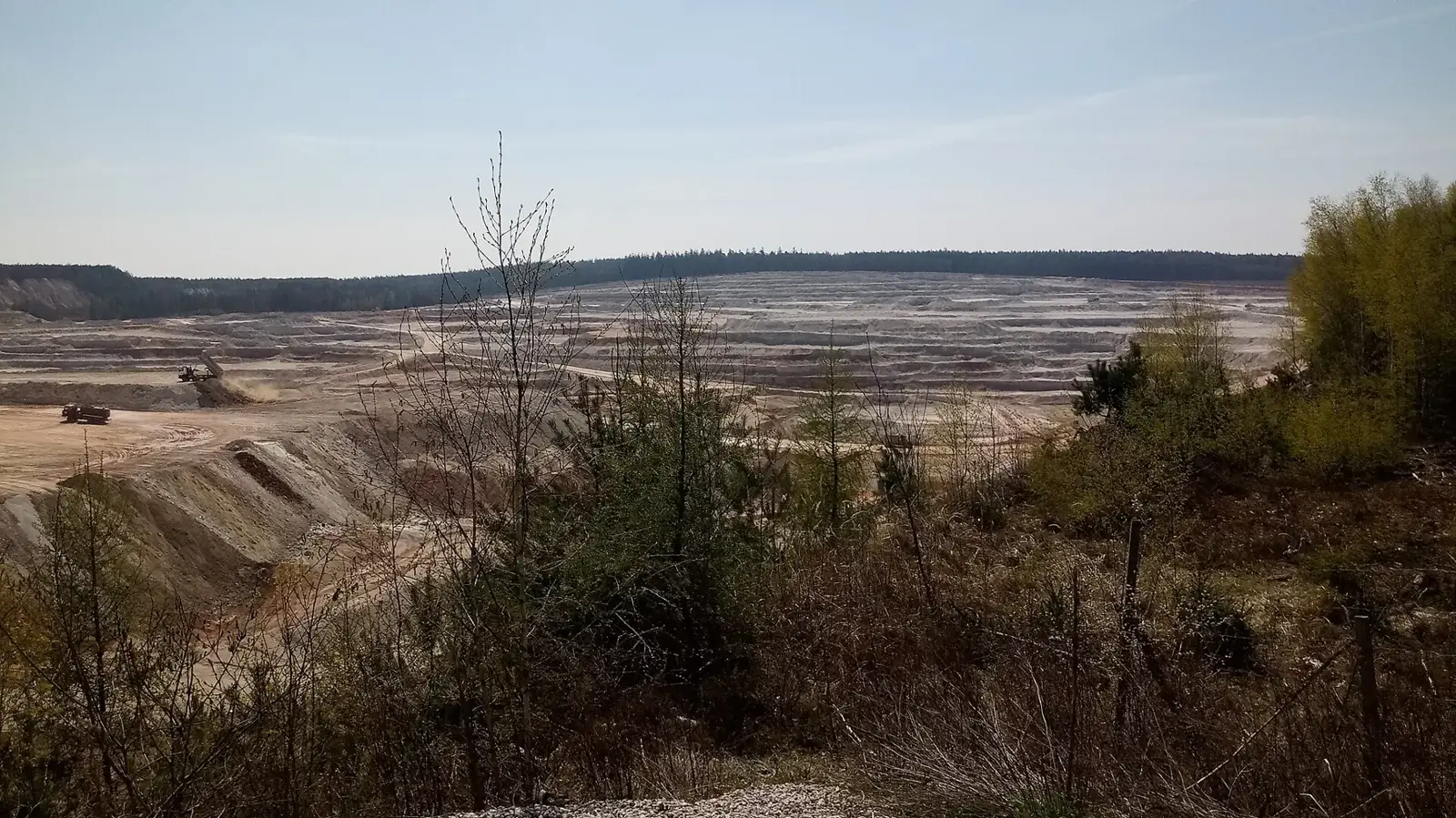 Terraced kaolin quarry walls (generic illustration)